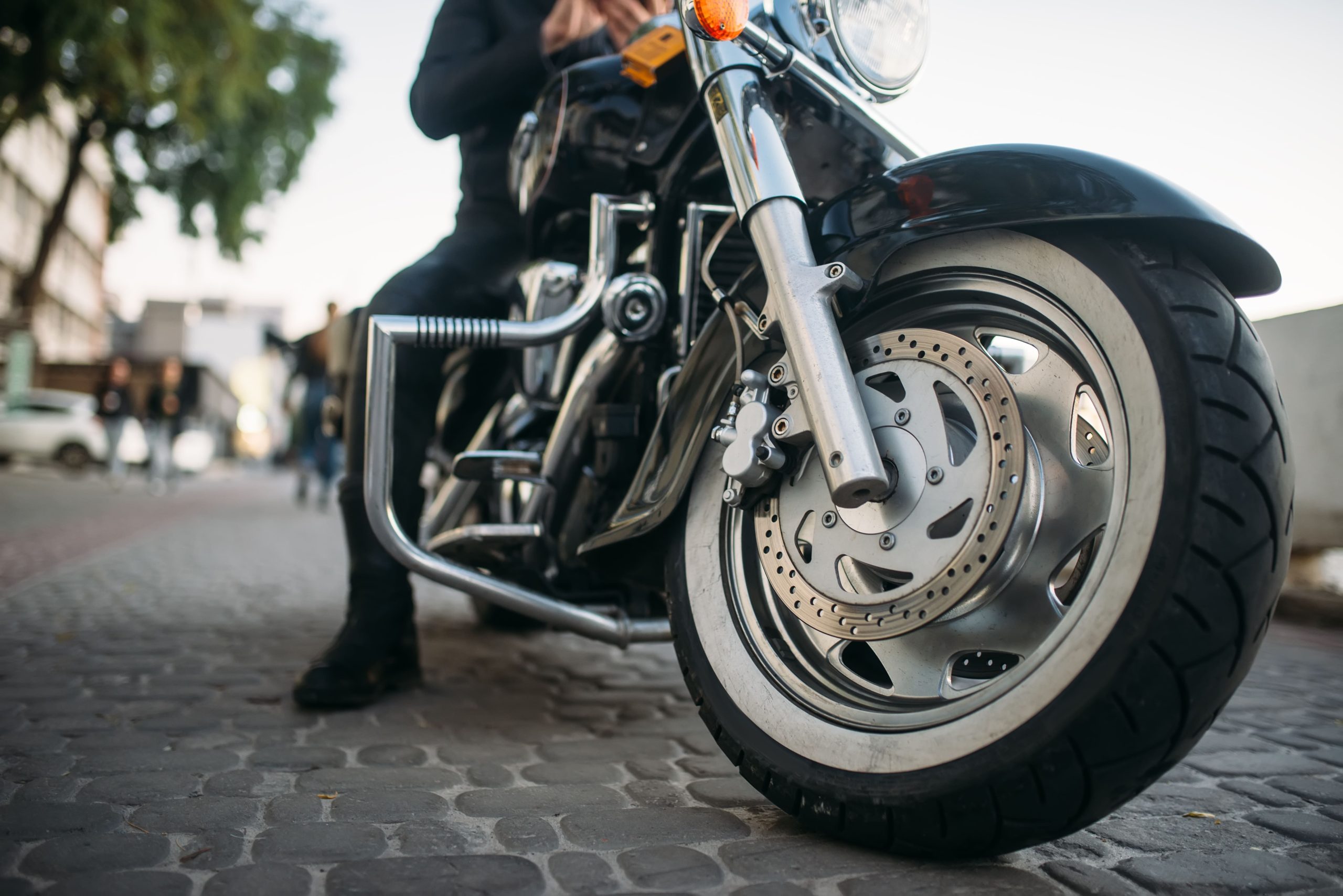 biker-poses-on-motorcycle-front-view-from-ground-2021-08-26-16-26-59-utc